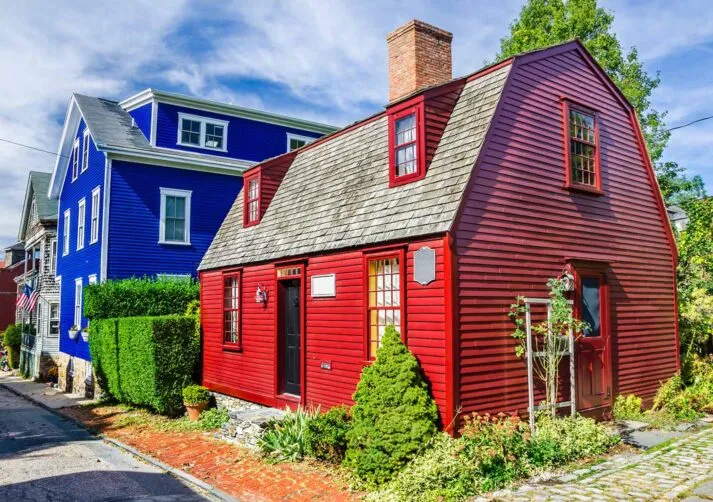 A view of a bright red New England house